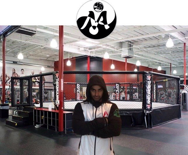 Mah Ghasemi outside the cage at his training facility